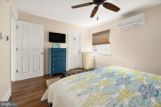 bedroom featuring a wall unit AC, dark wood-type flooring, and ceiling fan