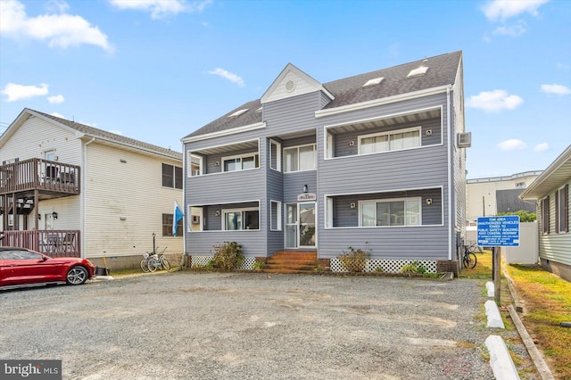 view of front of property with a balcony