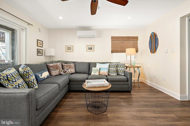 living room featuring dark hardwood / wood-style flooring, ceiling fan, and a wall mounted air conditioner