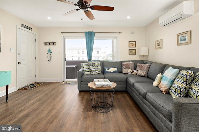 living room with ceiling fan, a wall mounted AC, and dark hardwood / wood-style floors