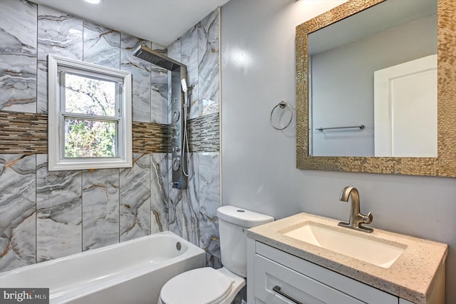 full bathroom featuring toilet, tiled shower / bath combo, and vanity