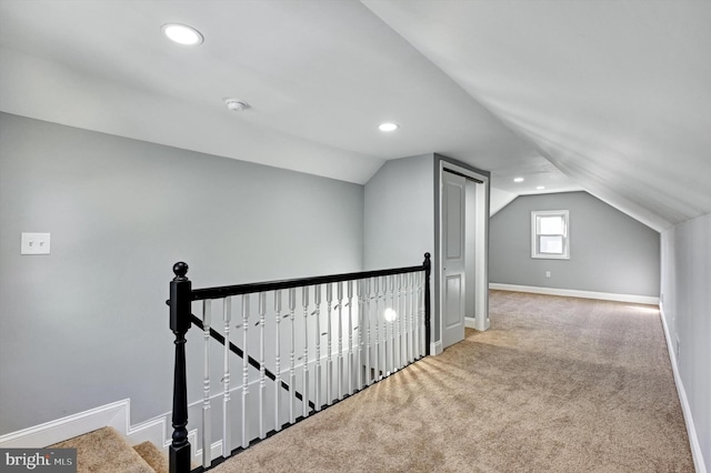 bonus room featuring lofted ceiling and light carpet