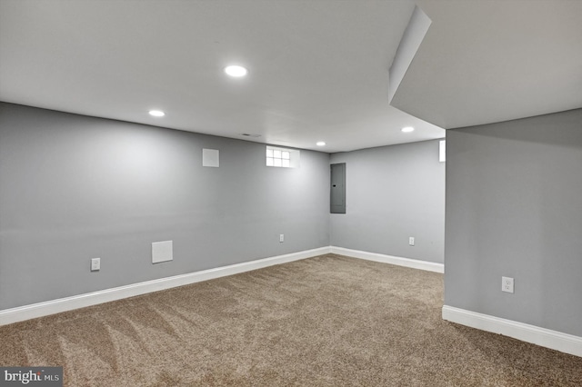 basement with carpet flooring and electric panel