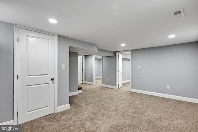 basement with light carpet