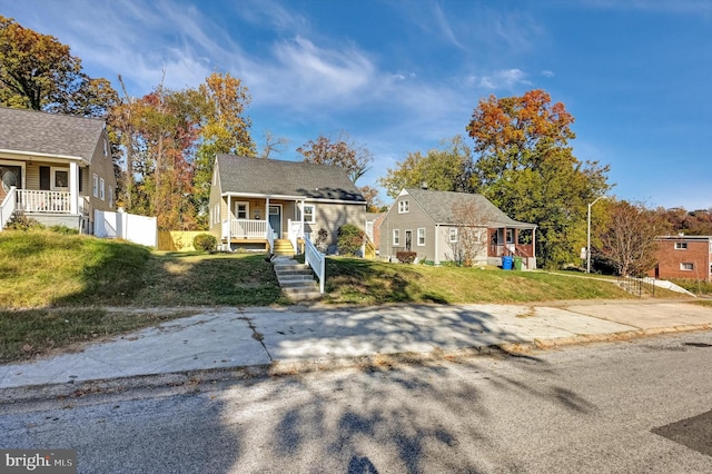 view of front of house featuring a front lawn and covered porch