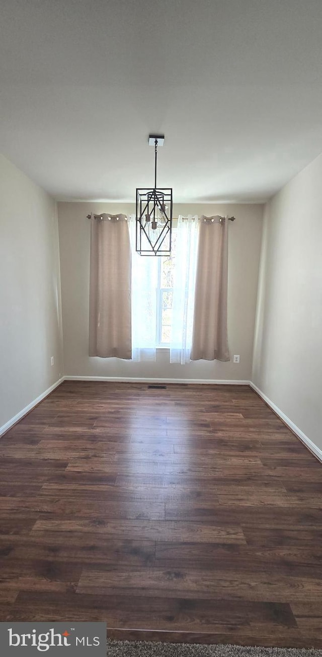 222 Dinwiddie Way, Kearneysville, WV 25430 - unfurnished dining area featuring a chandelier, dark wood-type flooring, and baseboards