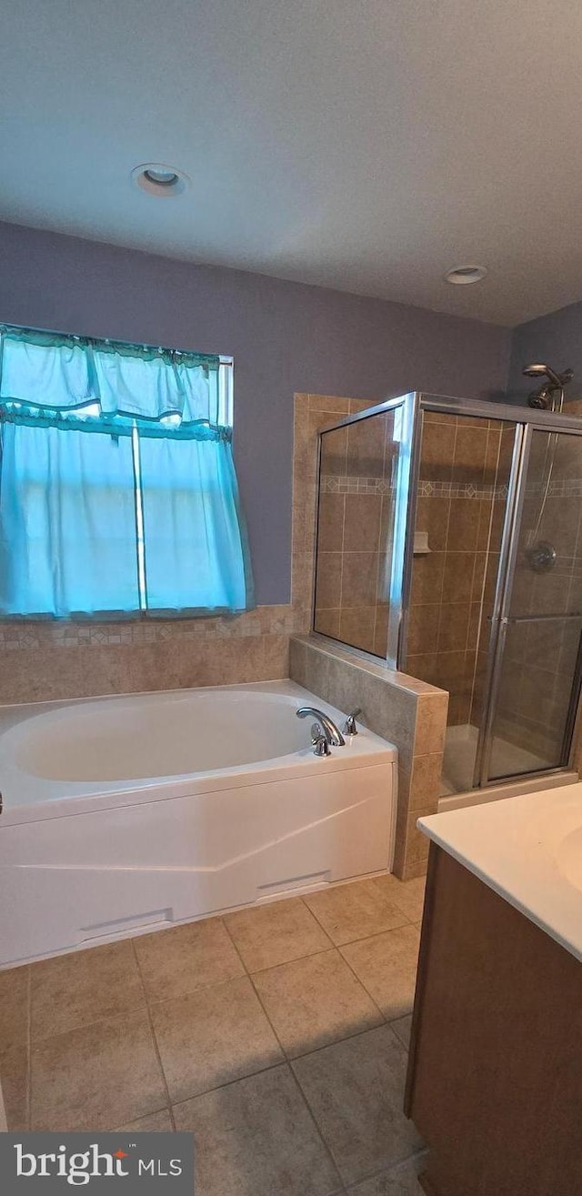 222 Dinwiddie Way, Kearneysville, WV 25430 - bathroom with tile patterned floors, a stall shower, a bath, vanity, and recessed lighting