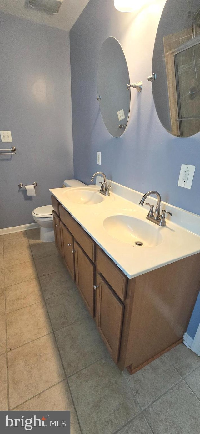 222 Dinwiddie Way, Kearneysville, WV 25430 - bathroom featuring tile patterned flooring, a shower with door, double vanity, and toilet