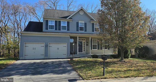 222 Dinwiddie Way, Kearneysville, WV 25430 - traditional-style house featuring driveway, covered porch, a front lawn, roof with shingles, and an attached garage