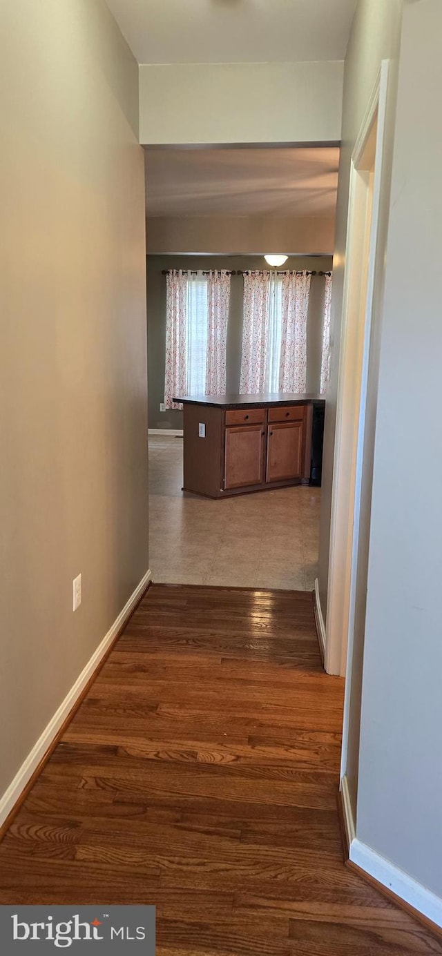 hallway featuring dark hardwood / wood-style flooring