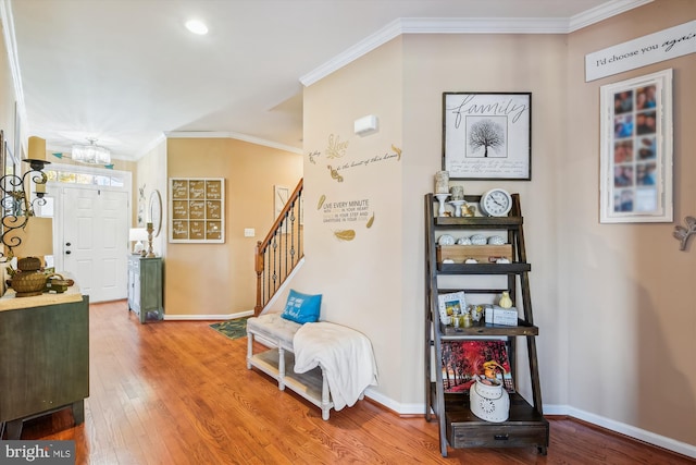 interior space with crown molding and hardwood / wood-style flooring