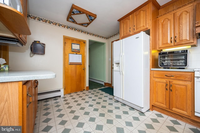 kitchen featuring white fridge with ice dispenser and a baseboard radiator