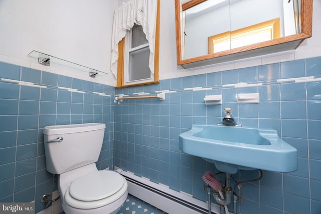 bathroom with tile walls and toilet