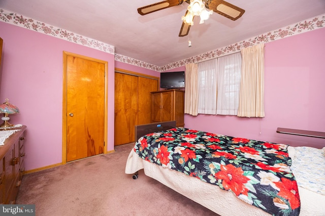 bedroom with ceiling fan and light carpet