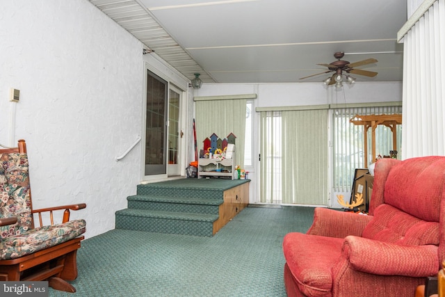 interior space with ceiling fan and carpet floors