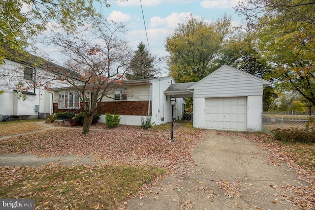 single story home with central AC and a garage