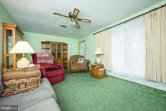 living room featuring carpet flooring and ceiling fan