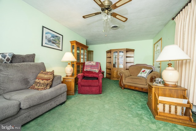 carpeted living room with ceiling fan