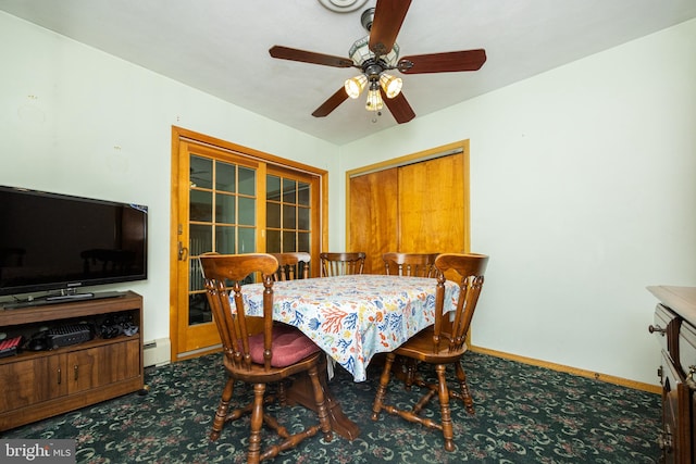 dining room with ceiling fan, carpet, and a baseboard heating unit