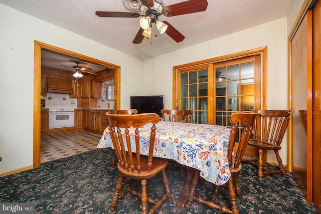 dining space with ceiling fan