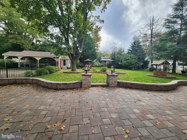 exterior space with a patio area and a lawn