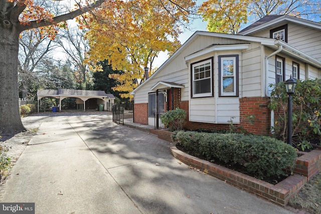 view of side of property featuring a carport