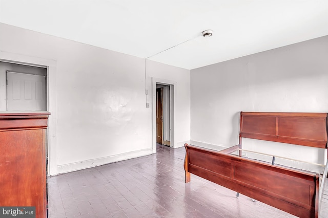 unfurnished bedroom featuring hardwood / wood-style flooring