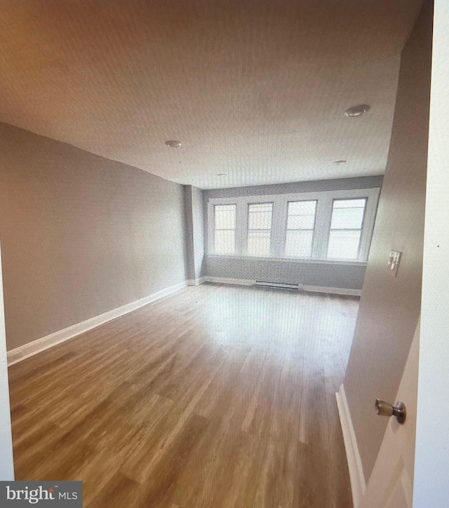 unfurnished room featuring wood-type flooring