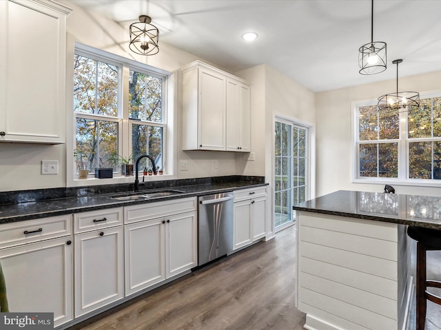 kitchen with white cabinetry, stainless steel dishwasher, sink, and plenty of natural light