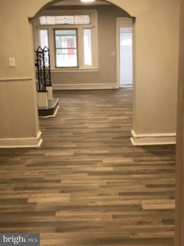 corridor featuring dark wood-type flooring