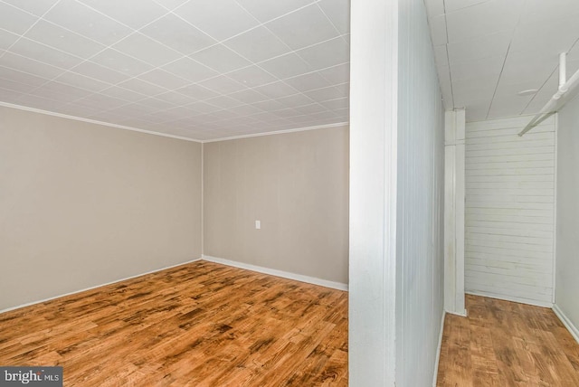 212 W Allen St, Mechanicsburg, PA 17055 - below grade area with ornamental molding, baseboards, and wood finished floors