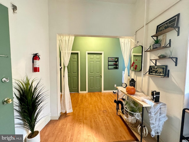 hall with hardwood / wood-style floors