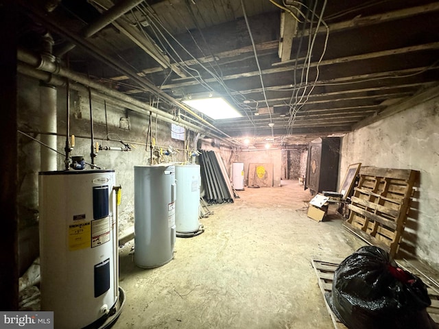 basement featuring electric water heater and water heater