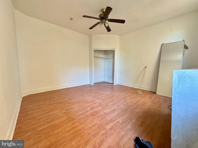 empty room featuring ceiling fan and hardwood / wood-style floors