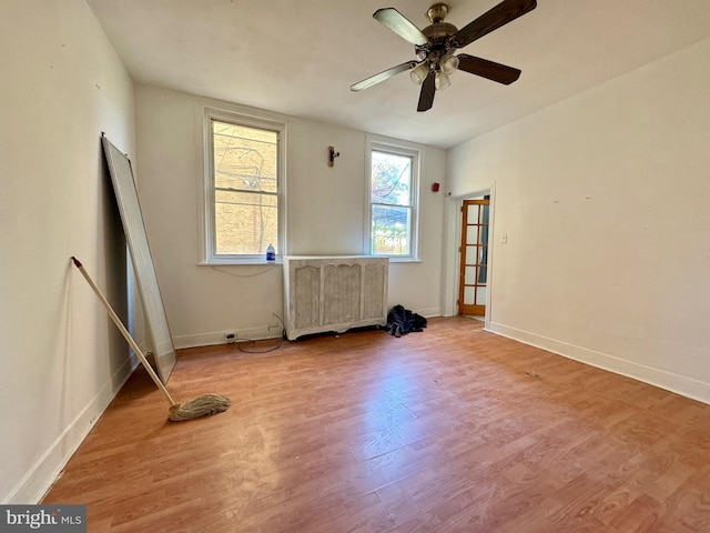 unfurnished room featuring ceiling fan and light hardwood / wood-style floors