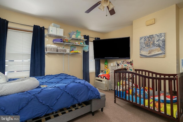 carpeted bedroom featuring ceiling fan
