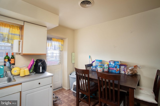 dining area featuring parquet floors