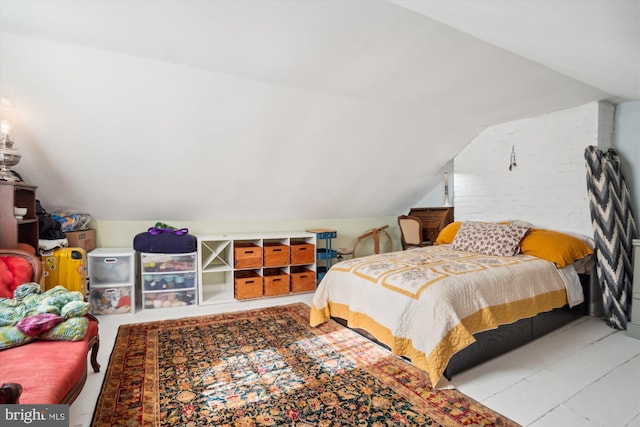 bedroom with lofted ceiling