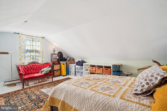 bedroom featuring baseboard heating and vaulted ceiling