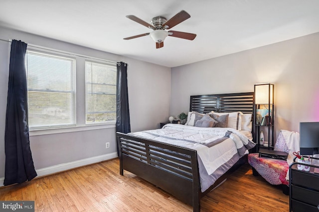 bedroom with light wood-type flooring and ceiling fan