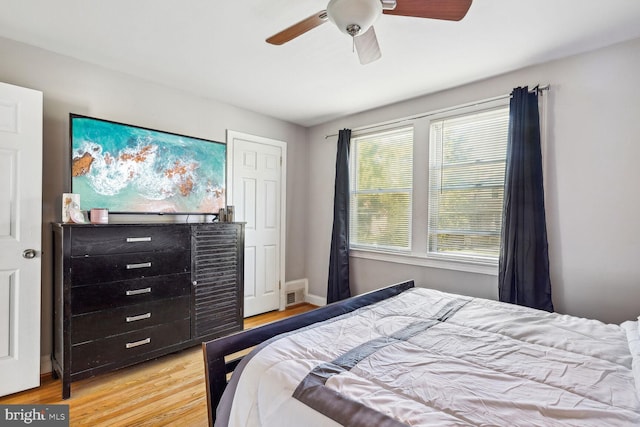 bedroom featuring light hardwood / wood-style flooring and ceiling fan