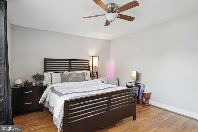 bedroom featuring light hardwood / wood-style flooring and ceiling fan