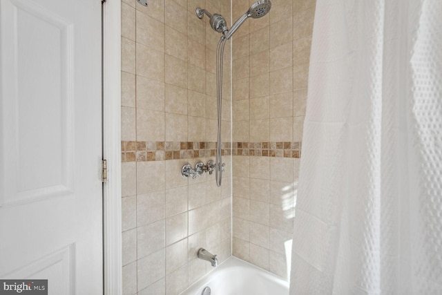 bathroom featuring shower / bathtub combination with curtain