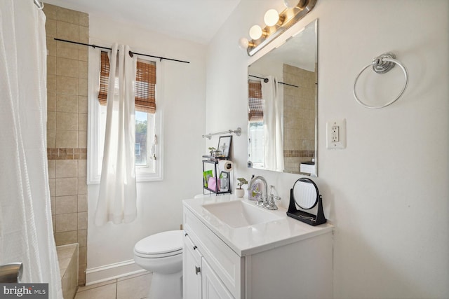 bathroom with vanity, toilet, and tile patterned flooring