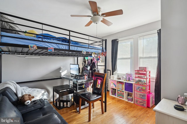 bedroom featuring ceiling fan and wood-type flooring