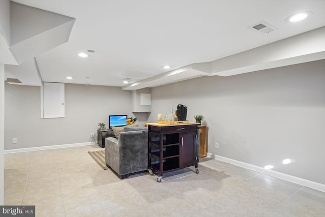 living room with light tile patterned floors