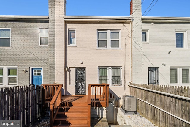 back of house featuring a deck and central air condition unit