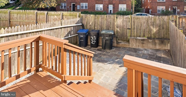 wooden deck with a patio area