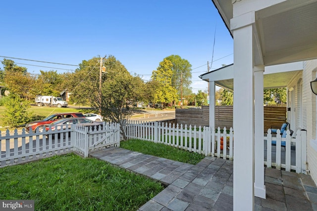 view of yard featuring covered porch