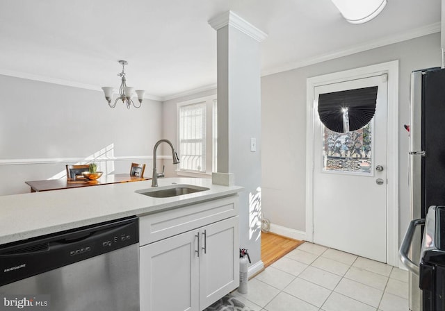 kitchen featuring crown molding, sink, white cabinetry, and stainless steel appliances